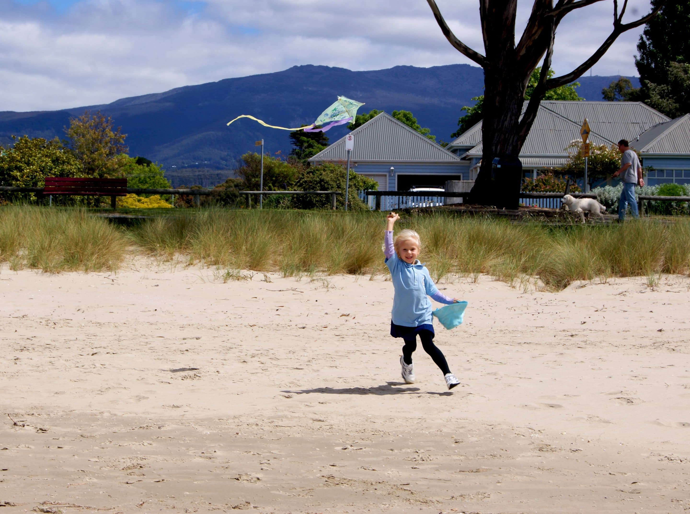 Girl flying a kite in Tasmania.