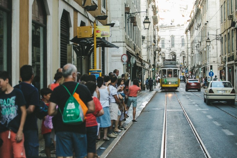 11-ways-to-build-a-dedicated-audience-for-your-blog-tourists-waiting-for-tram-on-city-street