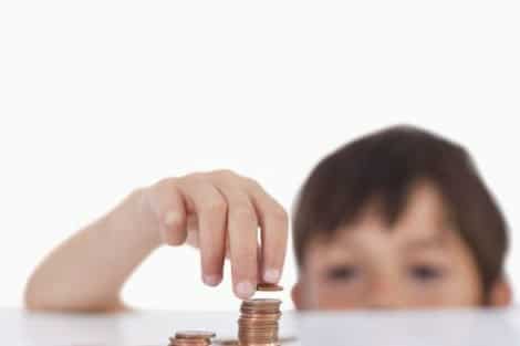 Financial-literacy-programs-need-to-get-real-child-counting-money