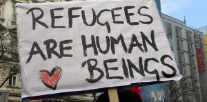 will-you-Stand_with_refugees-protest-sign
