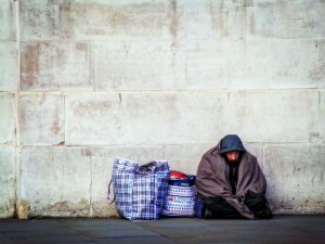 Unconditional-charity_Why-it's-okay-to-give-money-to-homeless-people-homeless-man-on-street-with-possesions